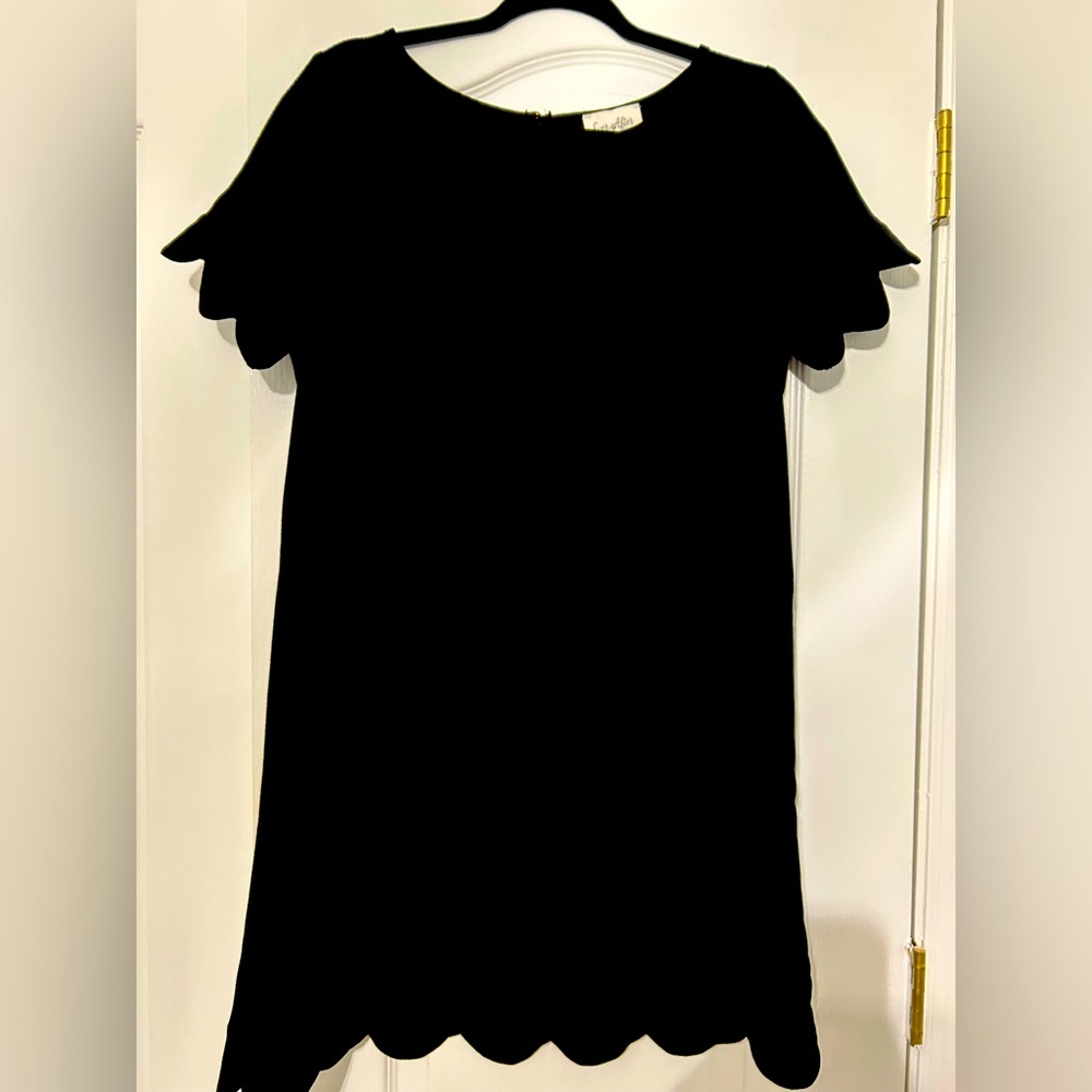 Ever After black unlined dress with scalloped sleeves and hem. Size L, NWT